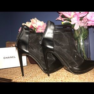 Black sheer heels. Very high heel.